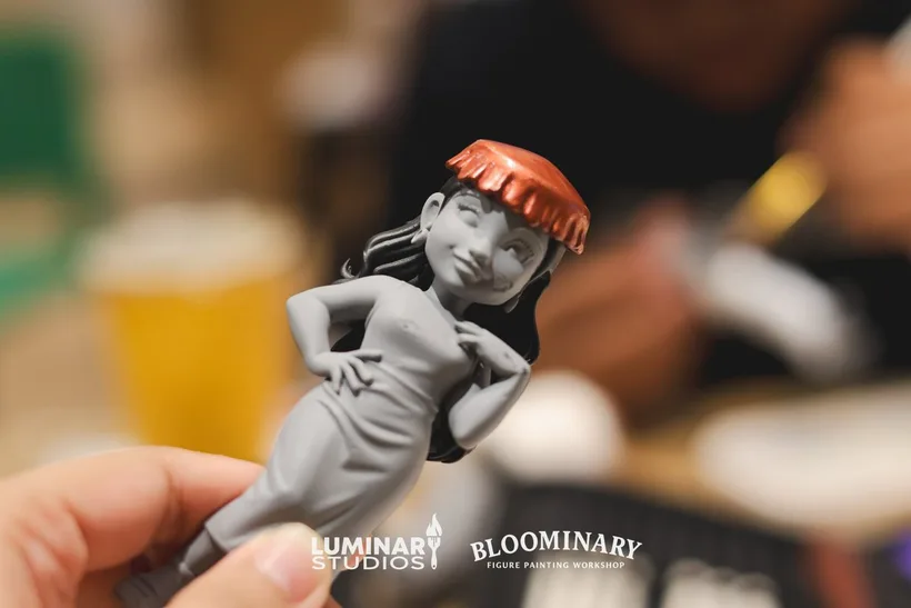 Detail of a custom BINI figurine wearing a red beret in progress