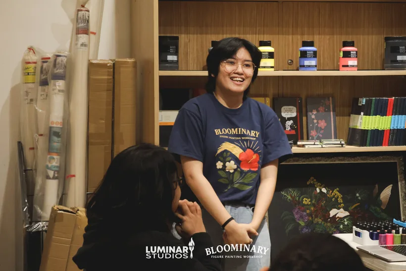 Bloominary host laughing during the BINI figure painting workshop