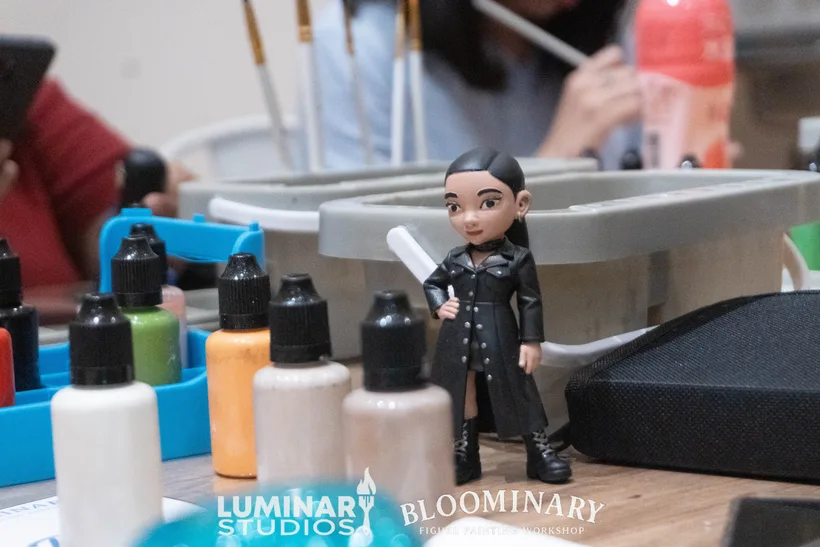 Finished BINI Jhoanna custom 3D resin figurine standing on the workshop table